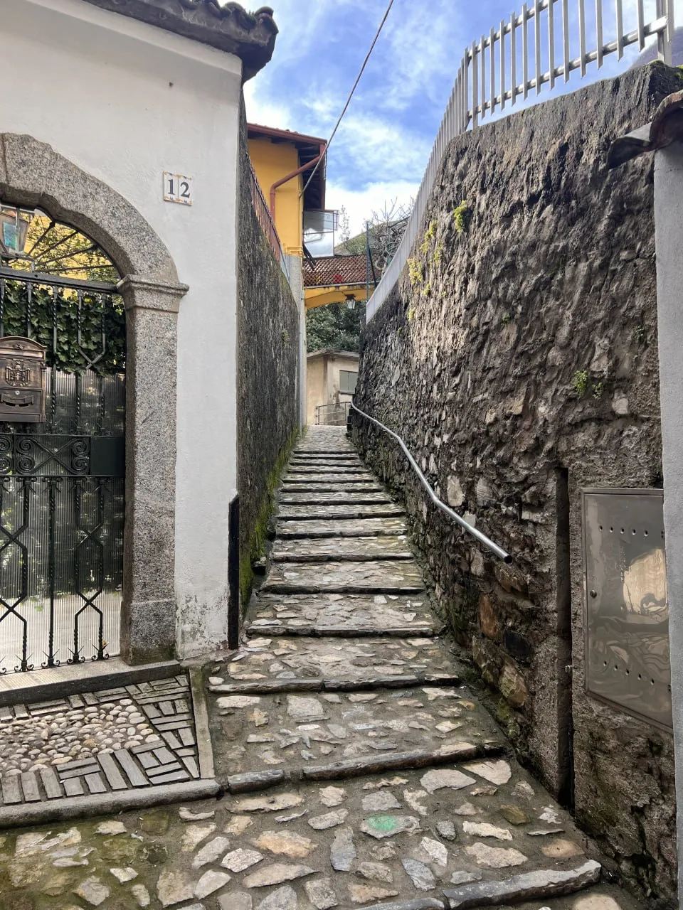Stone lane leading to the apartment in Laglio