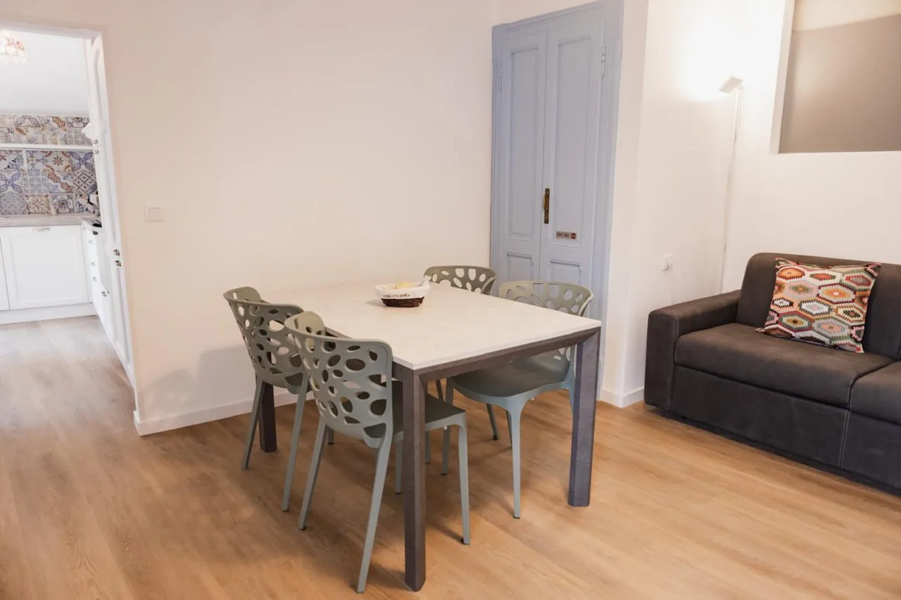 Dining area beside the kitchen and sofa