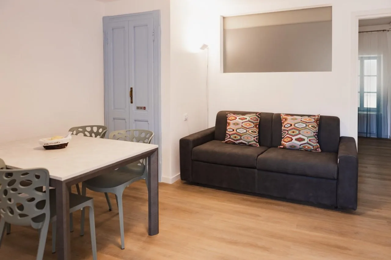 Sofa and dining area in the open-plan living room